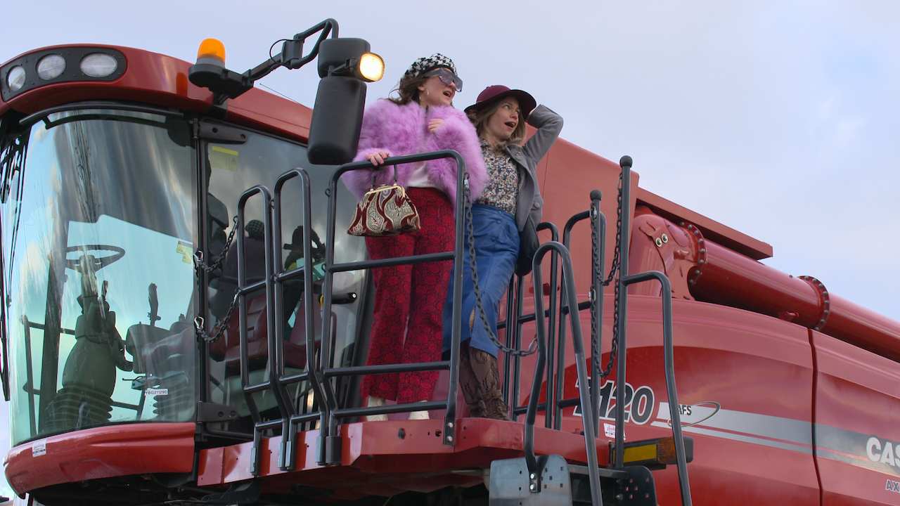 two women on the front of a train